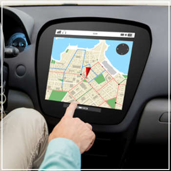 man operating touchscreen navigation in car 