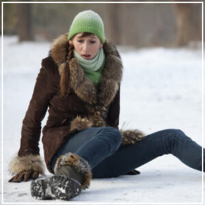 woman fallen on snow and ice